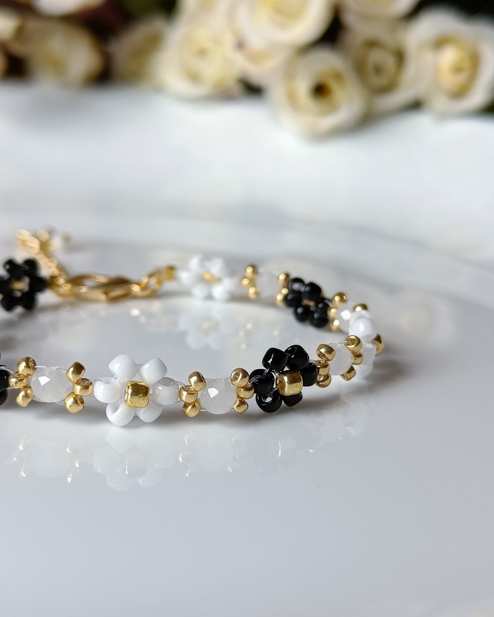 Minimal and elegant black and white flower beaded bracelet that is handmade with the finest Japanese seed beads.