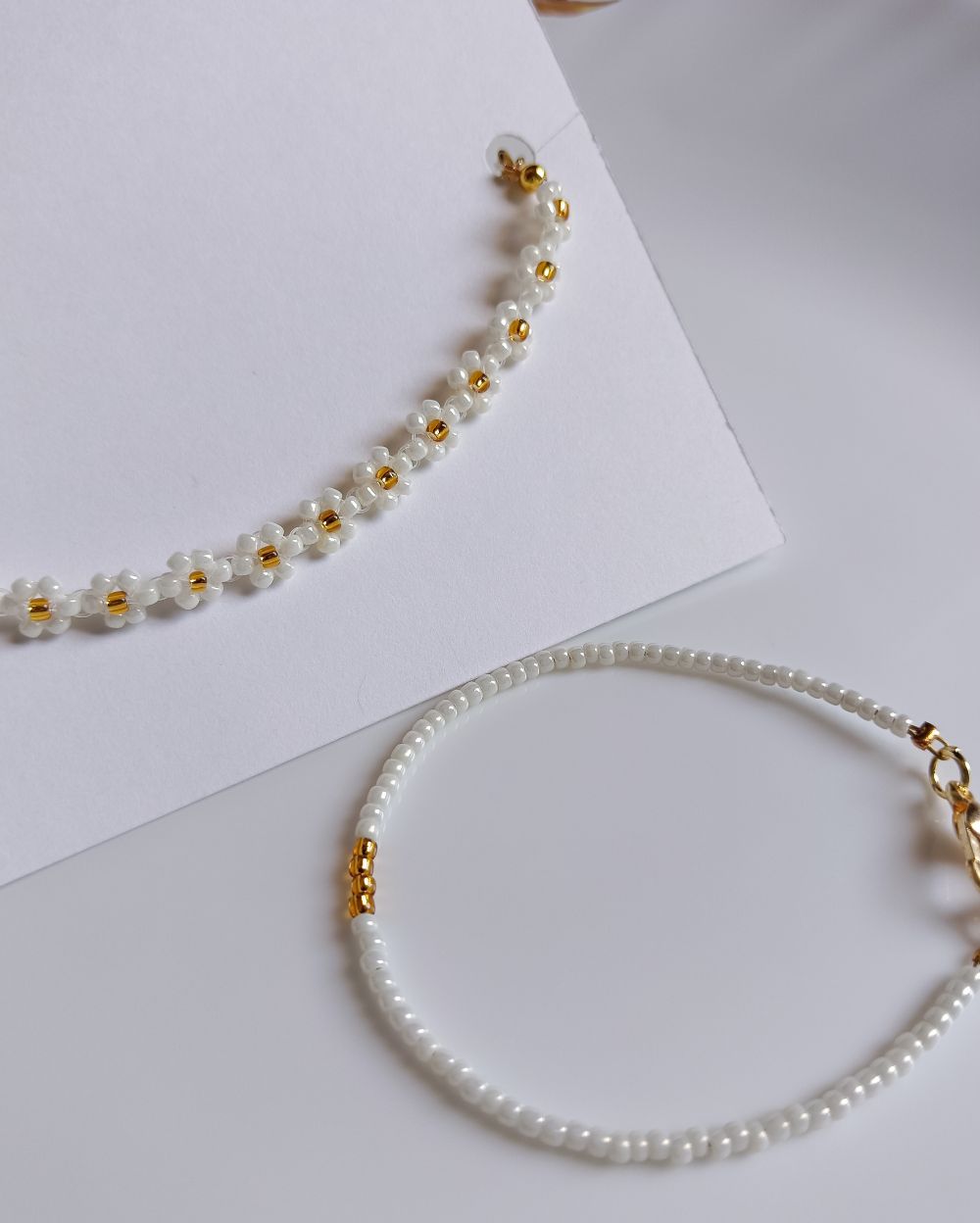 Minimal and chic handmade flower beaded bracelet and plain bracelet stack that is made with high quality Japanese seed beads