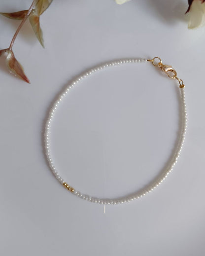 White beaded anklet handcrafted with high quality Japanese seed beads. It can be styled with casual outfits.