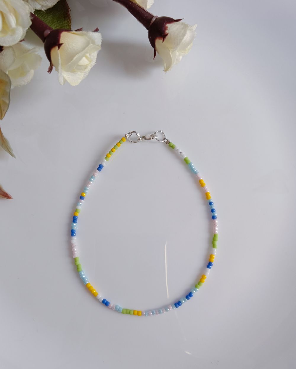 This Pastel Beaded Anklet is handmade with high quality Japanese seed beads and has pretty pastel shades of yellow, green, blue and pink. It's chic and minimal and perfect to style with your casual outfit.