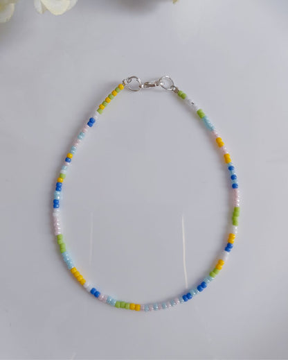 This anklet is made in pastel shades and of finest quality Japanese seed beads. It's minimal and chic and perfect to style with casual outfits.