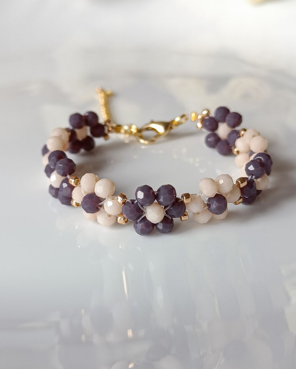 Purple and Beige flower beaded bracelet that is made of crystal beads and is perfect to pair with any outfit. Minimal and chic bracelet.