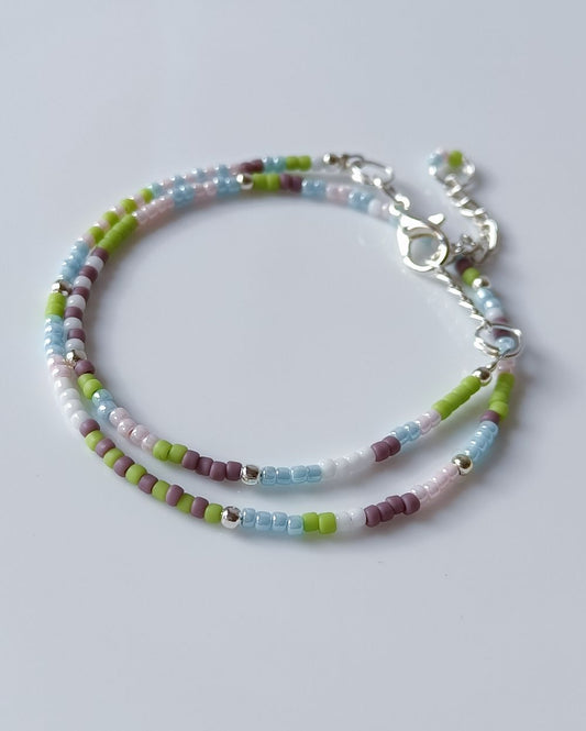 Wrap style beaded bracelet that is handmade with high quality Japanese seed beads in pastel shades. It can be effortlessly styled with any outfit.